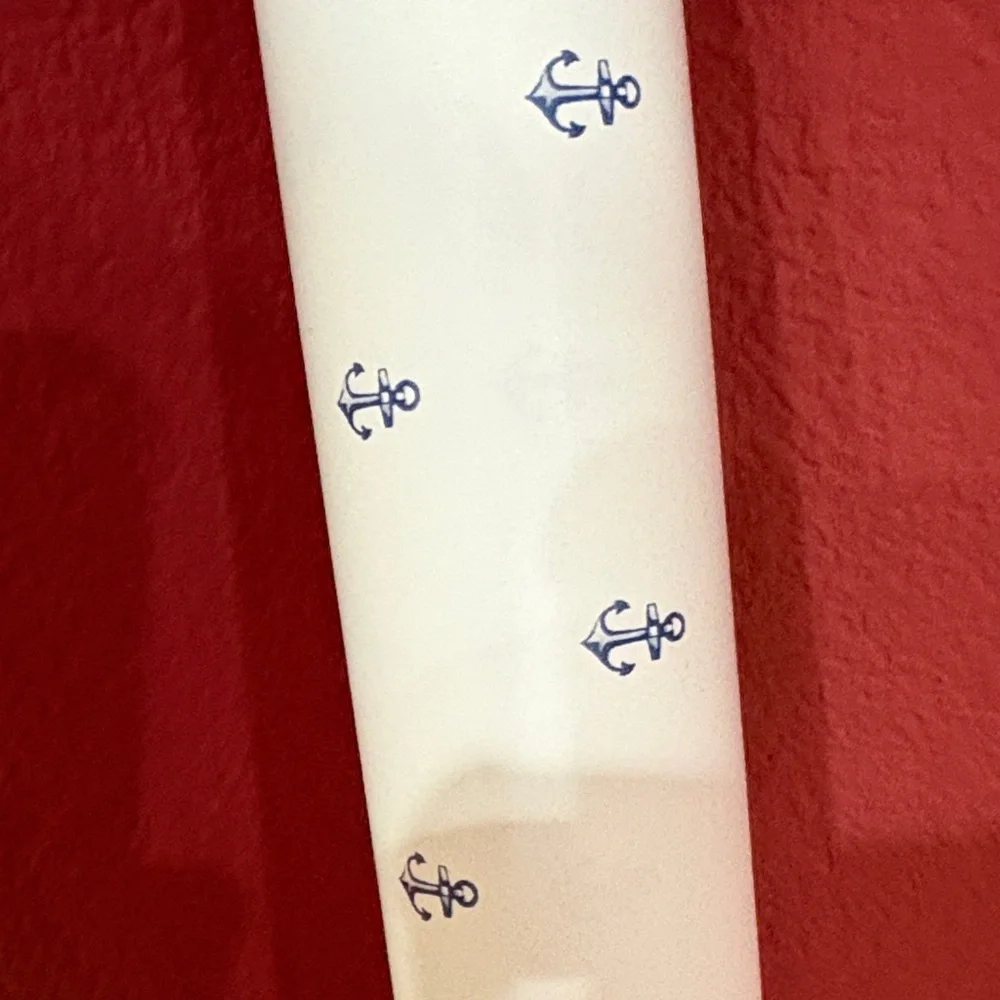 White and navy blue anchor wallpaper or use as wrapping paper.